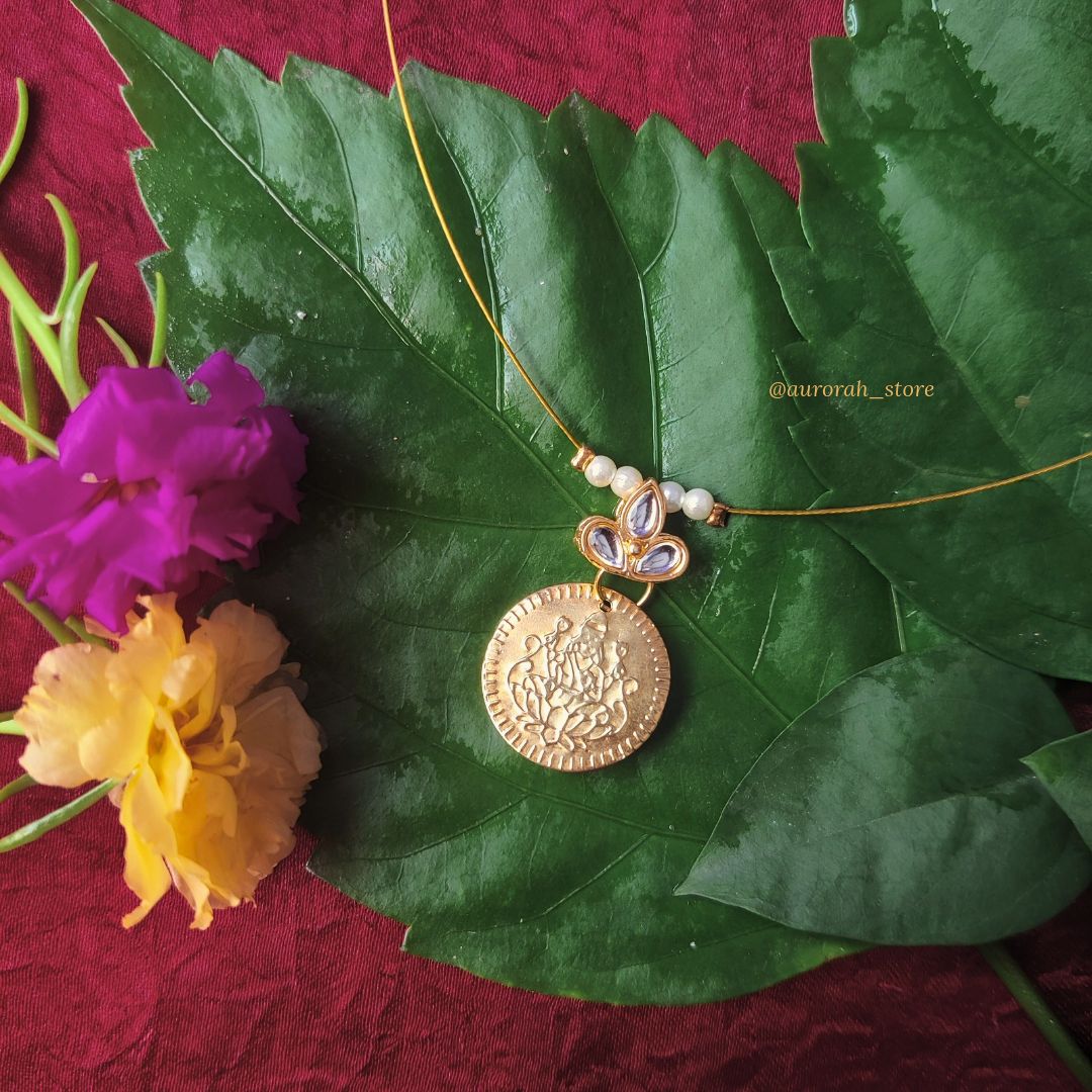 Antara - Lakshmi coin with white flower Invisible Jewelry AS025